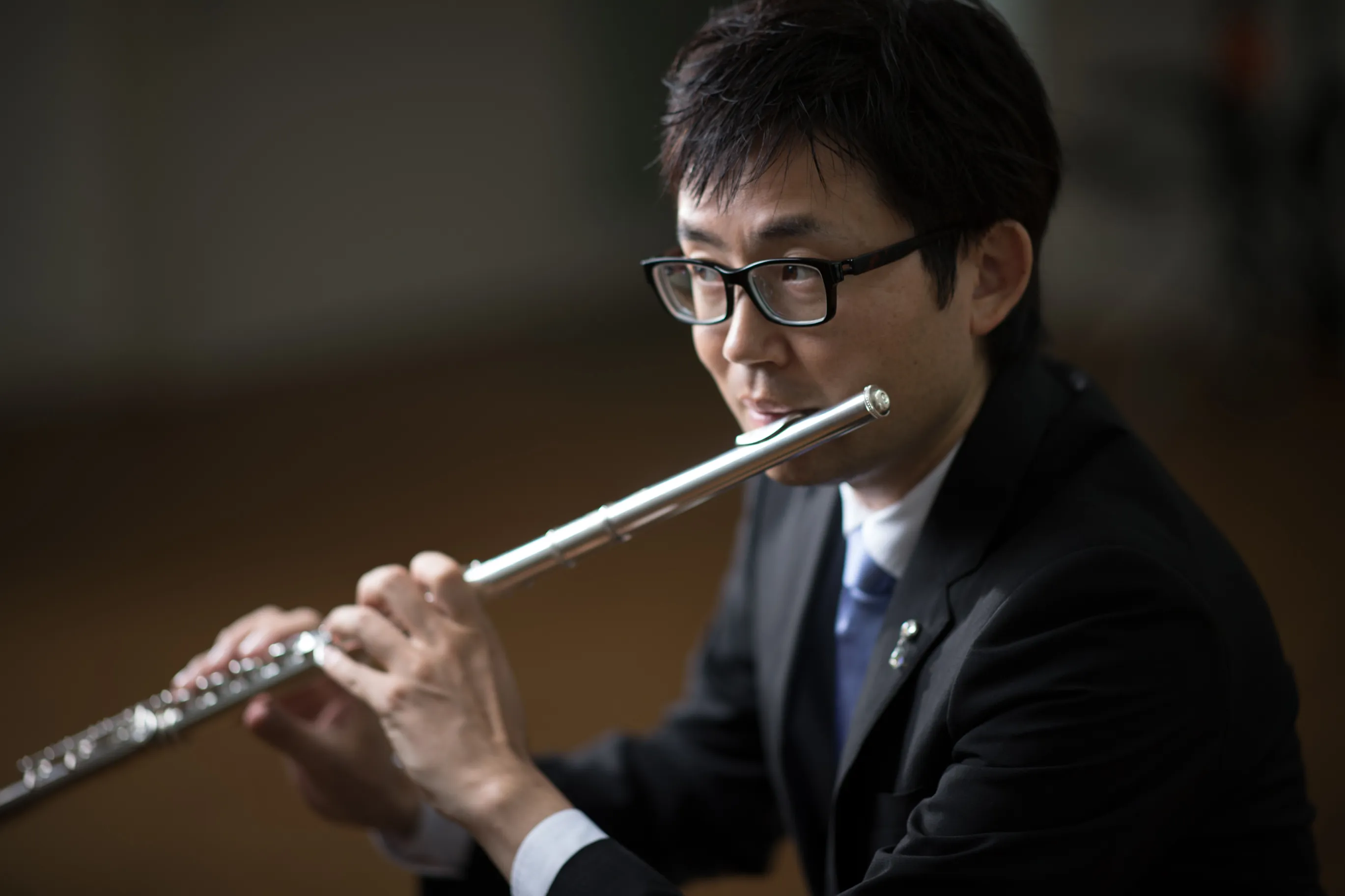 津田 顕克